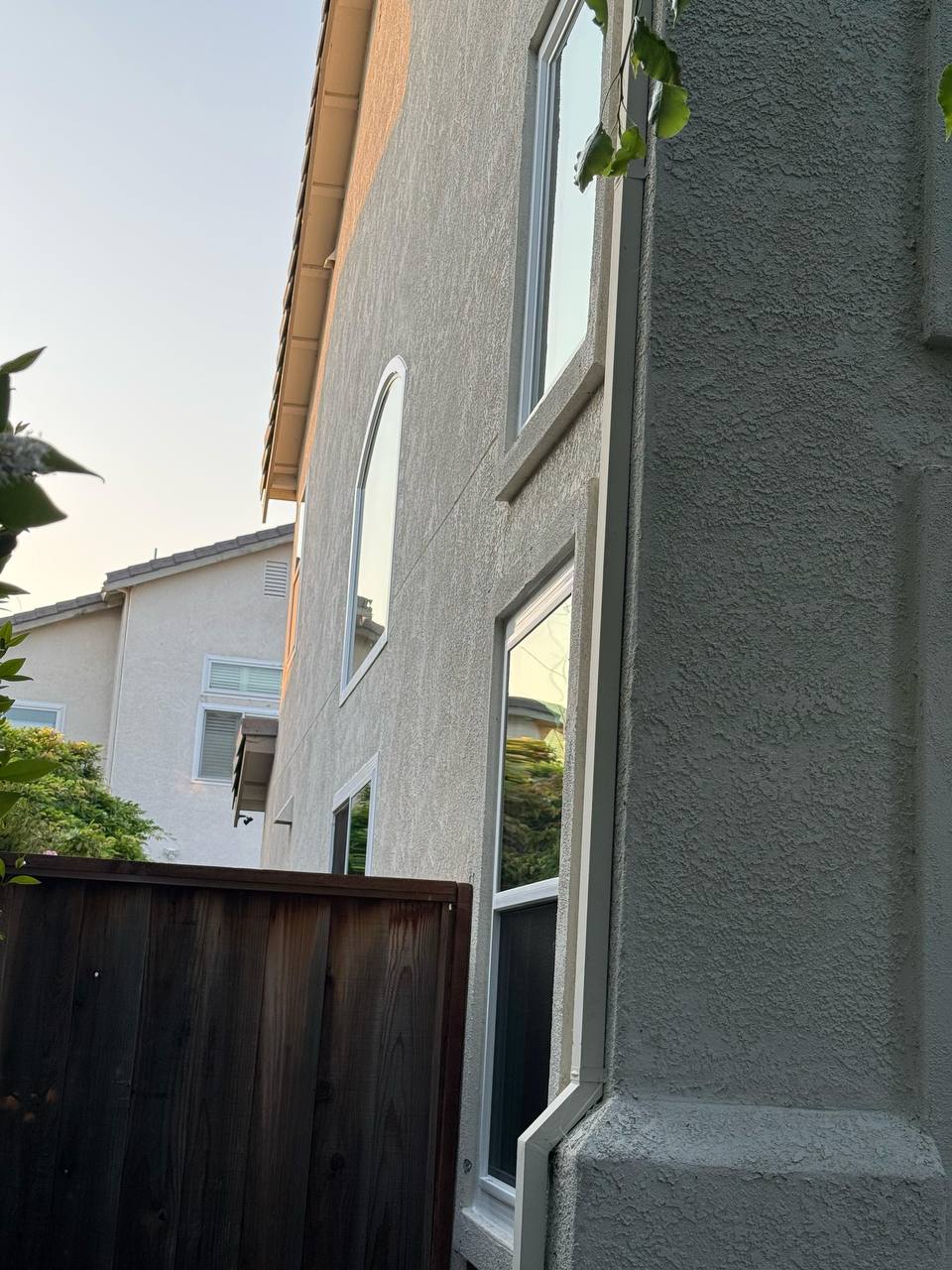 Arched specialty window on two-story home