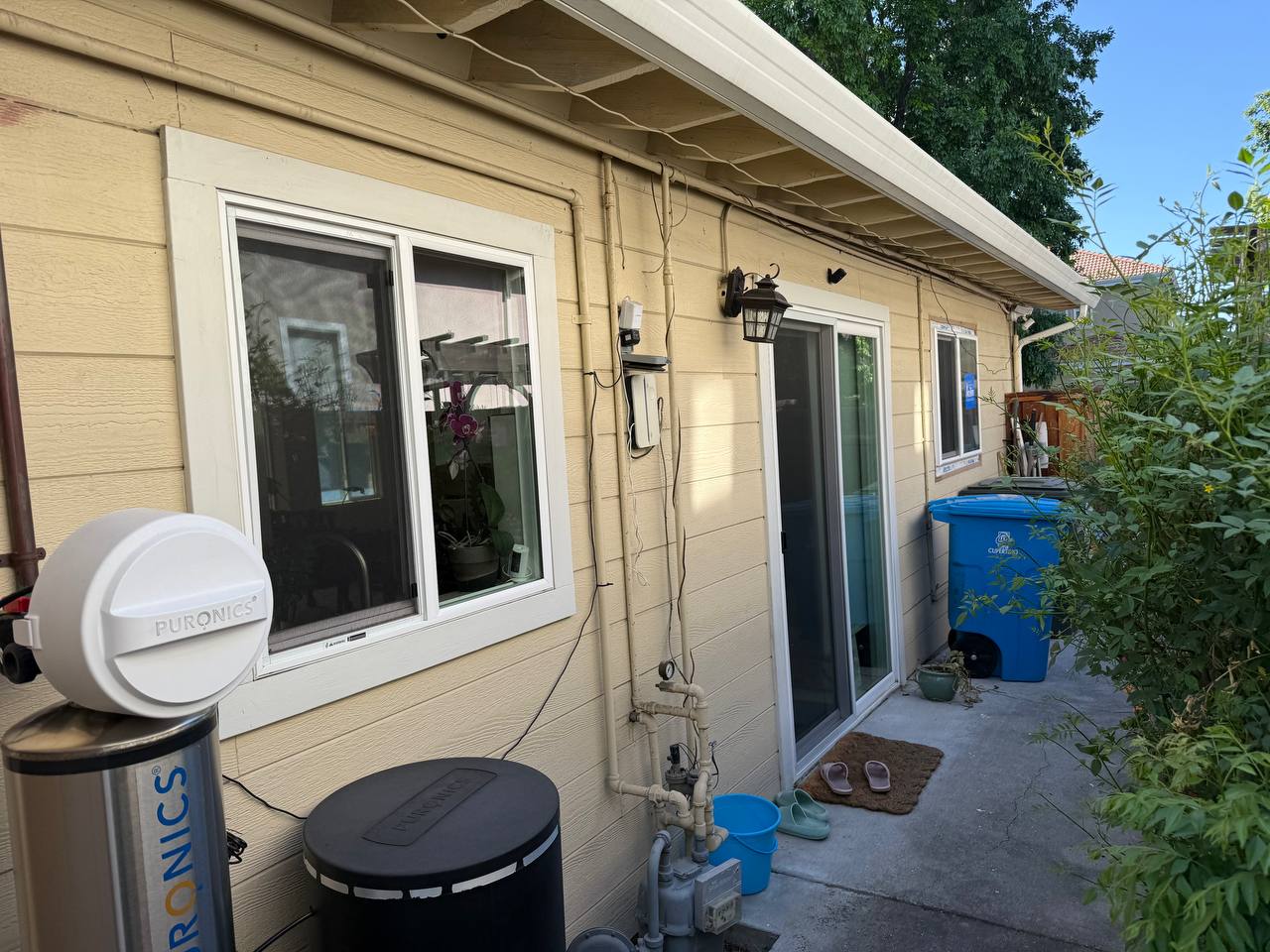 Backyard view through sliding window installation