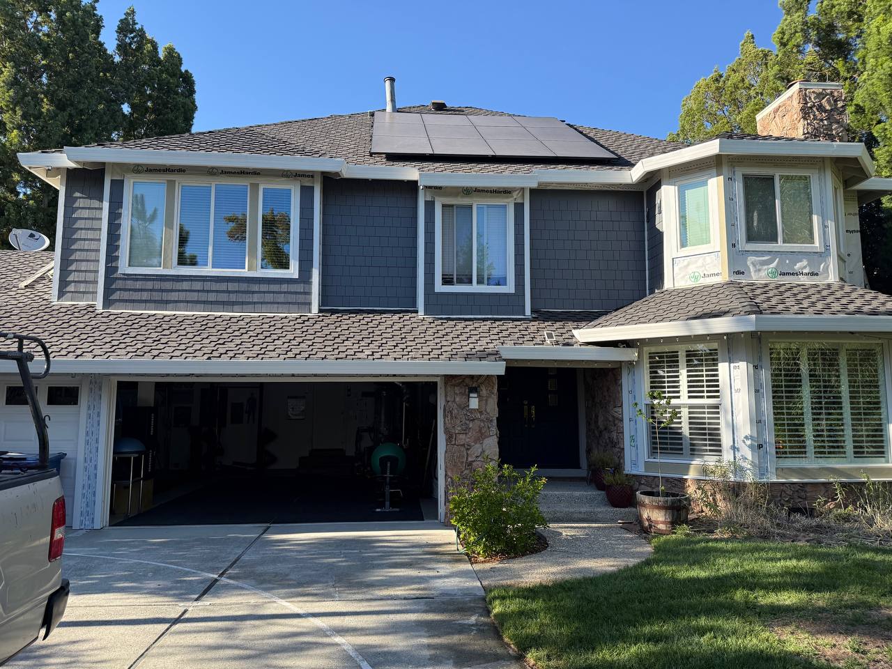 Two-story home with multiple window styles — full façade installation