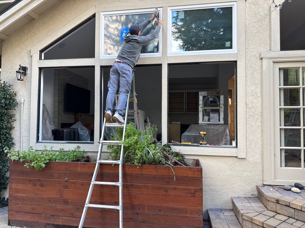 Milari technician installing a window on a residential home in the Bay Area